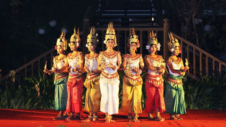 Apsara dancers performing in colorful costumes at Cambodian Cultural Village