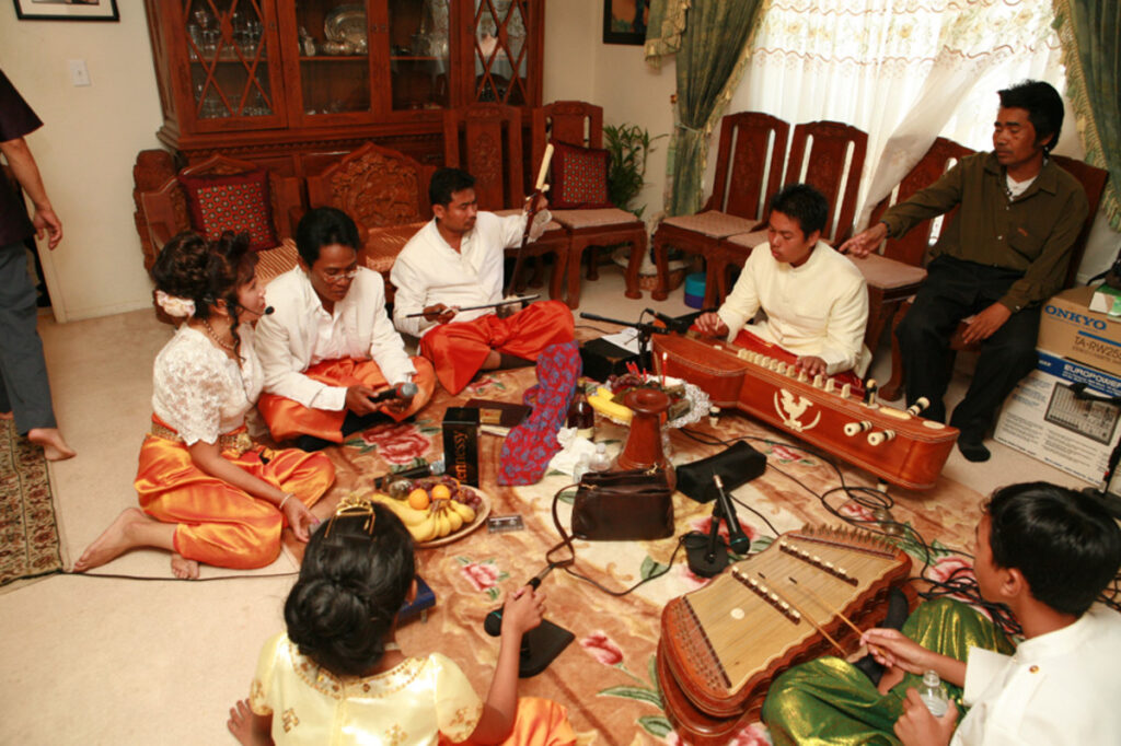 Traditional Khmer wedding with musicians playing classical instruments in Cambodia