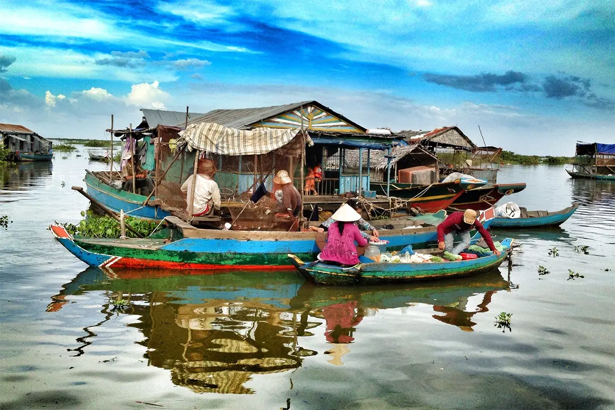 Stilt houses rising high above water in Kampong Phluk floating village, Cambodia