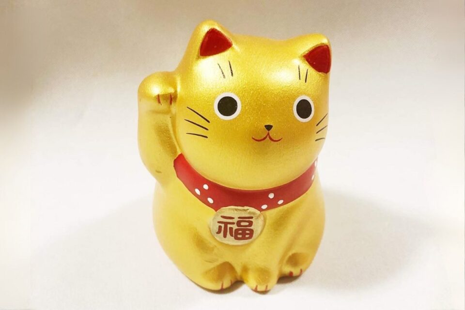 Lucky Waving Cat Maneki Neko gold statue with raised paw