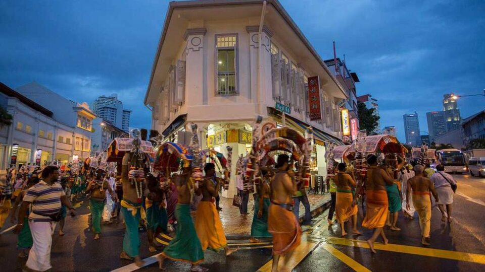 Hindu devotees walking in a religious procession through Little India, Singapore.